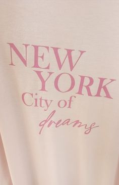 the new york city t - shirt has pink lettering on it