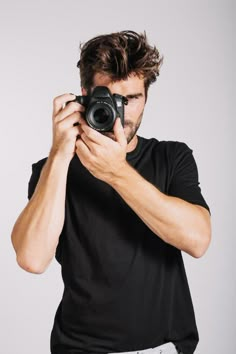 a man taking a photo with his camera