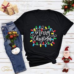 Merry Christmas Tshirt, Christmas Lights Shirt, Merry Christmas Tee, Christmas Gift Shirt, Christmas Lights Tees, Xmas Holiday T-Shirt NOTE: We use black design for White, Light Grey Heather( Athletic Heather), Pink, Heather Peach, Mint Green, Burnt Orange colors. For other colors we will use white design. Hi There! First of all thank you for being here and checking out our finest t-shirt designs.  We dedicated ourselves to provide the best possible service for our valuable customers. In order to provide you best service, we are using the quality materials and beautiful designs. You can always contact us for your questions or for your suggestions. We are open for your suggestions. ✔ How To order; 1-) Please, check and review all photos 2-) Choose your t-shirt size and color 3-) Click add t Festive Christmas Crew Neck T-shirt, Christmas Holiday T-shirt With Letter Print, Christmas Crew Neck T-shirt With Letter Print, Christmas Holiday Graphic T-shirt, Christmas Holiday Graphic Print T-shirt, Christmas Holiday Letter Print T-shirt, Christmas Graphic Print T-shirt, Christmas Letter Print Crew Neck T-shirt, Christmas Graphic Tee Shirt For Holiday