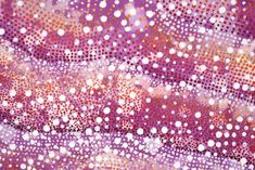 an abstract background with circles and dots in purple, pink, orange and white colors