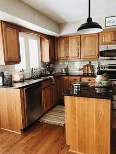 the kitchen is clean and ready for us to use in its new owner's home