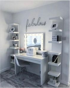 a white desk topped with a mirror next to a shelf filled with books and other items