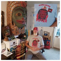 a man sitting in front of a t - shirt that says alaska native potter