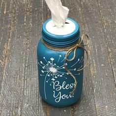 a blue mason jar with a tissue dispenser