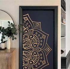 the door is decorated with an intricate gold design on it's black front door