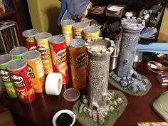 a table topped with lots of different types of cans and containers on top of it