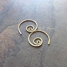 Small 14k gold filled spiral hoop earrings. Petite AND make a statement: win- win! Formed and cold forged from 20 gauge 14k gold filled wire into this small coil. The ends have been sanded for comfort in wearing, then polished to a light shine. * Small spiral hoop earrings are approximately 17mm in diameter. Please see measurement photo. You can also choose sterling silver at the dropdown to the right. If you are looking for the larger version of this style click here: https://www.etsy.com/listi Gold Spiral Wire Wrapped Hoop Earrings, Swirl Shaped Nickel-free Hoop Earrings As Gift, Swirl Hoop Earrings Nickel Free Gift, Gold Spiral Wrap Earrings Nickel Free, Nickel-free Swirl Hoop Earrings Gift, Spiral Yellow Gold Hoop Earrings For Gift, Spiral Yellow Gold Hoop Earrings As Gift, Yellow Gold Spiral Hoop Earrings For Gift, Gold Minimalist Spiral Wrap Earrings