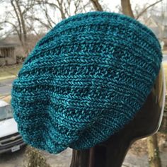 a close up of a knitted hat on a mannequin's head