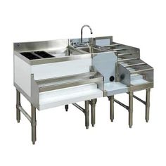 three stainless steel sinks with two faucets on each side and one sink in the middle