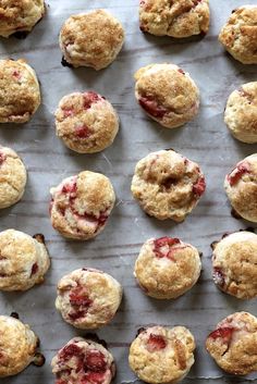 freshly baked strawberry muffins on a baking sheet ready to be eaten for breakfast