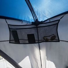 the inside of a tent with an open umbrella