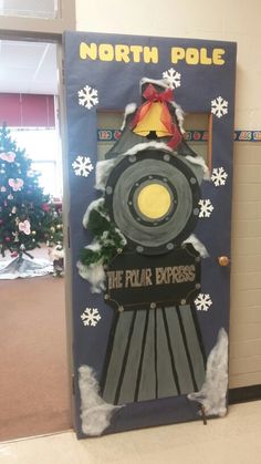 a door decorated to look like a train with snowflakes on it and the words north pole