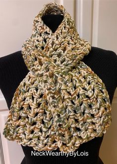 Looking for a short, warm, comfortable, easily-adorned scarf?  Well, here it is, just for you! MATERIALS Double-Thread (two yarns) 100% Acrylic  "I Love This Yarn" brand - Green Camo Stripes "I Love This Yarn" brand - Ivory Hand-crocheted by me in my smoke-free studio.  SIZE Approximately 39" long by 5-1/2" wide FEATURES 🧣 Double-thread construction.  🧣 Fashionably short, open weave, crochet, keyhole, pull-through scarf.  🧣 Fits cozily around your neck hanging straight or criss-crossed by inserting end of scarf into keyhole opening.  🧣 Medium-weight scarf can be worn comfortably both indoors (air conditioned spaces in summer  or with lowered thermostat in winter) and outside depending on the season. 🧣 Also a perfect scarf for folks in assisted-care.  CARE INSTRUCTIONS Hand wash or mac Beige Casual Scarf, Casual Beige Scarf, Casual Cream Scarves One Size Fits All, Casual Cream Scarf One Size, Casual Cream Scarf, One Size, Casual Cream Scarves For Winter, Casual Cream Scarf For Winter, Handmade Casual Scarves For Fall, Beige Casual Scarves One Size