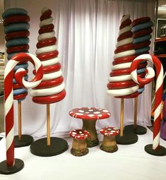 red, white and blue candy cane sculptures on display