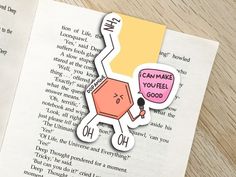 an open book with some stickers on it next to a piece of paper that says, can make you feel good