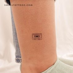 a person with a tattoo on their leg that has an old school radio on it