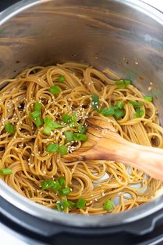 an instant pot noodle recipe with garlic and green onions