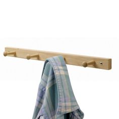 a wooden coat rack with two coats hanging from it's sides and a blue plaid shirt on the hanger