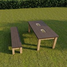 a table and bench sitting in the grass