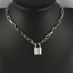 925 Silver Plated Padlock Necklace: Stainless Steel Chain with Lock Charm - A Stunning Jewelry Gift for Women Introducing a stunning addition to your jewelry collection that is sure to make a statement on any special occasion. This exquisite piece has been meticulously crafted with precision and care, making it a true embodiment of modern elegance and sophistication. From birthdays and weddings to anniversaries and graduations, this piece is the perfect gift for any special event.Whether you're looking to surprise a loved one or treat yourself, this piece of jewelry is a must-have addition to any wardrobe. Its versatile design allows it to complement any outfit, making it the perfect accessory for any occasion. With the holiday season just around the corner, this luxurious piece is the per Lock Jewelry Necklaces, Silver Chain Necklace With Lock, Metal Chain Necklace With Lock For Gift, Silver Chain Link Necklace Gift, Silver Chain Link Necklaces For Gift, Silver Chain Link Necklace For Gift, Silver Metal Necklace With Lock Detail, Silver Chain Link Charm Necklace With Lobster Clasp, Silver Lock Necklace Gift