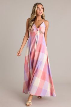 Indulge in the dreamy charm of our Pastel Dreams Pink Multi Plaid Cotton Blend Maxi Dress. Effortlessly stylish with a soft plaid print in blush pink hues, this maxi dress is perfect for any occasion. Show off your quirky personality and add a touch of playfulness to your wardrobe with this must-have piece! This pink maxi dress features a v-neckline, a self-tie bust feature, thin self-tie straps that cross in the back, an open back, a discrete back zipper, a large plaid pattern, and a 22.5" front slit.  80% Polyester, 20% Cotton Lined 80% Polyester, 20% Cotton Hand Wash Cold Manufactured in China Designed in the USA Model is wearing a size small Sorority Rush Dresses, Halter Bridesmaid Dress, Rush Dresses, Pink Maxi, Dress Bra, Black Dresses Casual, Dresses Red, Pink Maxi Dress, Little White Dresses