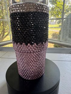 there is a vase made out of beads