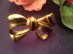 "This goldtone bow pin can really give a  vintage look to any outfit.  It is a beautiful goldtone with a soft luster.  This brooch is unsigned but definitely reflects the style of the bow ribbon pins that started in the 30s. .  It measures about 2.5\" across by about 1.25\" across from point to point.  This versatile statement pin can be worn for any occasion. A striking brooch that can make even the simplest shirt, tee,  sweater, or jeans have attitude! I think is would also look striking on a Ribbon Pin, Bow Brooch, Jewelry Brooch, Purse Gift, Wedding Sash, Bow Ribbon, Vintage Ribbon, Belt Purse, Brooch Vintage