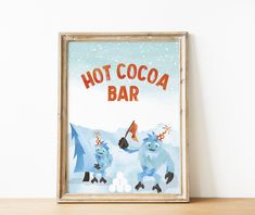 there is a picture frame with an image of two animals on it and the words hot cocoa bar