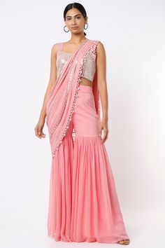 Featuring a blush pink sharara saree in raw silk and georgette base. It is paired with a contrasting blouse having mirror work and a drape.  FIT: Fitted at bust and waist. COMPOSITION: Raw silk, Georgette. CARE: Dry clean only. Pink Georgette Saree, Sharara Saree, Pink Sharara, Embroidered Sharara, Contrast Blouse, Indian Fashion Designers, Light Pink Color, Pernia Pop Up Shop, Mirror Work