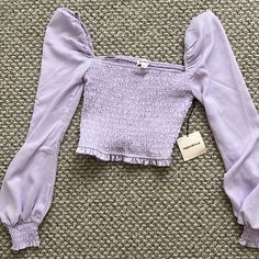 Nwt. Superdown Purple Bell Sleeve Crop Top With Ruched Middle. Trendy Fitted Smocked Top For Brunch, Trendy Fitted Ruched Smocked Top, Trendy Stretch Smocked Top For Brunch, Trendy Ruched Smocked Top For Spring, Trendy Long Sleeve Ruched Smocked Top, Trendy Fitted Smocked Top With Ruched Details, Spring Stretch Smocked Top With Ruched Detail, Trendy Long Sleeve Smocked Top With Ruched Detail, Casual Fitted Smocked Top With Ruched Details