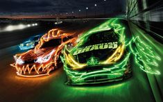 the cars are glowing in green and orange lights on the track at night time,