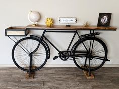 a bicycle is sitting on a table with some decorations