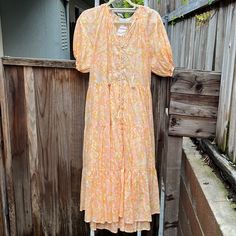 Olivaceous Pierre Peach Midi Dress Size Large 100% Cotton Lining: 100% Rayon Never Been Worn; Tags Still Attached Peach Midi Maxi Dress For Day Out, Feminine Orange Midi Dress For Beach, Peach Midi Dress For Day Out, Spring Apricot Midi Dress For Beach, Peach Knee-length Midi Dress For Spring, Feminine Peach Midi Dress For Day Out, Peach Midi Dress For Brunch, Peach Midi Length Dress For Brunch, Spring Orange Feminine Maxi Dress