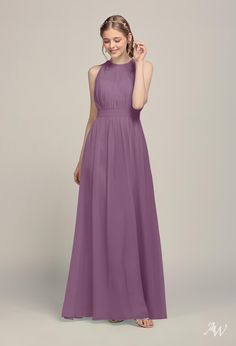 a woman in a long purple bridesmaid dress with halt neckline and pleaed skirt