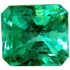 a green emerald is shown on a white background