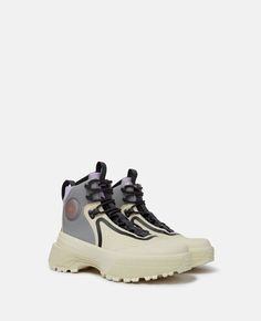 Discover Stella's Sand/Utility Black/Purple Glow Terrex Hiking Boots today. Free standard shipping is available on all orders. Shop online now. Bungee Cord, Adidas By Stella Mccartney, Mid Top, Sand Beige, Stella Mccartney Adidas, Lilac Purple, Waterproof Fabric, Gore Tex, Stella Mccartney