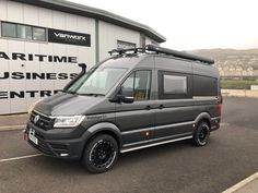 a van parked in front of a building