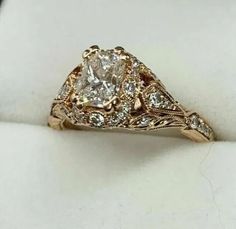 a fancy engagement ring set in yellow gold