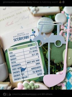 an assortment of golf related items are displayed in a box with the name and date on it