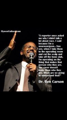 a man in a suit and tie holding a microphone with a quote from dr ben carson on it