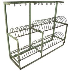 three tiered metal rack with hooks on each side