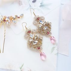 Chandelier statement wedding earrings. Hand embroidered with rhinestone on Venice lace, topped with lovely crystals. Earrings are very light and comfortable to wear, you can order matching bracelet and hair pins (separately). You can as well order earrings in other rhinestone crystals. This earrings will be shipped nicely packed in the gift box. For other wedding jewelry visit my shop; https://www.etsy.com/shop/byPiLLowDesign Elegant Pink Crystal Earrings, Crystal Jeweled Bridal Earrings For Wedding, Glamorous Crystal Earrings For Weddings, Rose Gold Crystal Bridal Earrings For Wedding, Pink Crystal Drop Bridal Earrings, Wedding Crystal Embellished Chandelier Drop Earrings, Gold Jeweled Bridal Earrings For Wedding, Glamorous Crystal Bridal Earrings For Wedding, Elegant Pink Crystal Bridal Earrings