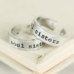 "This Soul Sisters Ring Set is stamped by hand, one letter at a time on 1/4\" wide aluminum blanks and wrapped by hand to fit your size. Please avoid contact with water to keep the black in the lettering and designs from fading. Our rings are made out of Pure 1100 Aluminum, which is food safe and does not tarnish. They contain no Zinc or Magnesium which are often found in common aluminum and can cause skin reactions. This also means it doesn't contain the properties of other metals that might ta Meaningful Silver Jewelry With Custom Text, Personalized Silver Friendship Rings, Personalized Adjustable Rings For Friendship, Adjustable Personalized Rings For Friendship, Adjustable Inspirational Stamped Rings, Sisters Ring, Country Best Friends, Bff Rings, Best Friend Rings