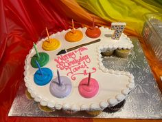 a birthday cake decorated with icing and candles