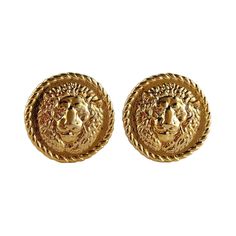 GIANNI VERSACE Profumi vintage gold toned clip-on earrings featuring an ancient Roman lion head. Embossed GIANNI VERSACE PROFUMI. Indicative measurements : diameter approx. 2.7 cm (1.06 inches). Comes with the original dust bag. NOTES - This is a preloved vintage item, therefore it might have imperfections. - Colors may differ slightly from actual product appearance due to differences in lighting conditions. - As a buyer, you are fully responsible for customs duties, other local taxes and any ad Lion Earrings, Luxury Private Jets, Vintage Designer Jewelry, Vintage Versace, Lion Head, Gianni Versace, Earring Backs, Cute Jewelry, Vintage Gold