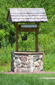 a small wooden structure with a sign on it