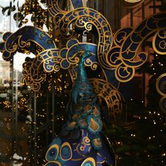 a blue and gold decoration in a store window