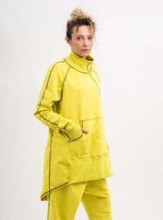 Grab a look from the archives with this Yellow asymmetrical sweatshirt women. In a yellow colour minimal design, this sweatshirt is made from a soft cotton blend to keep your feelin' comf' and chilled out. Coming in an overhead design, this Yellow asymmetrical sweatshirt women has one side front pocket, and a zipper with two sliders. Finished with thumb holes on the sleeves. This Cotton sweatshirt women plus size clothing is designed to flatter every body type and fit perfect. When we designed t Oversized Yellow Sweatshirt For Loungewear, Yellow Oversized Sweatshirt For Loungewear, Yellow Long Sleeve Sweatshirt In Athleisure Style, Yellow Long Sleeve Sweatshirt Athleisure, Yellow Long Sleeve Sweatshirt For Athleisure, Yellow Athleisure Sweatshirt For Fall, Yellow Fall Athleisure Sweatshirt, Khaki Overalls, Asymmetrical Sweatshirt