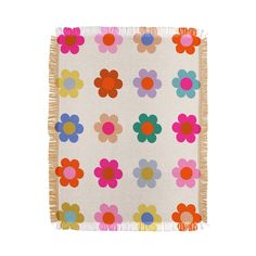 a white rug with colorful flowers on it