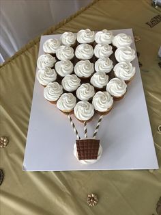 cupcakes are arranged in the shape of a hot air balloon